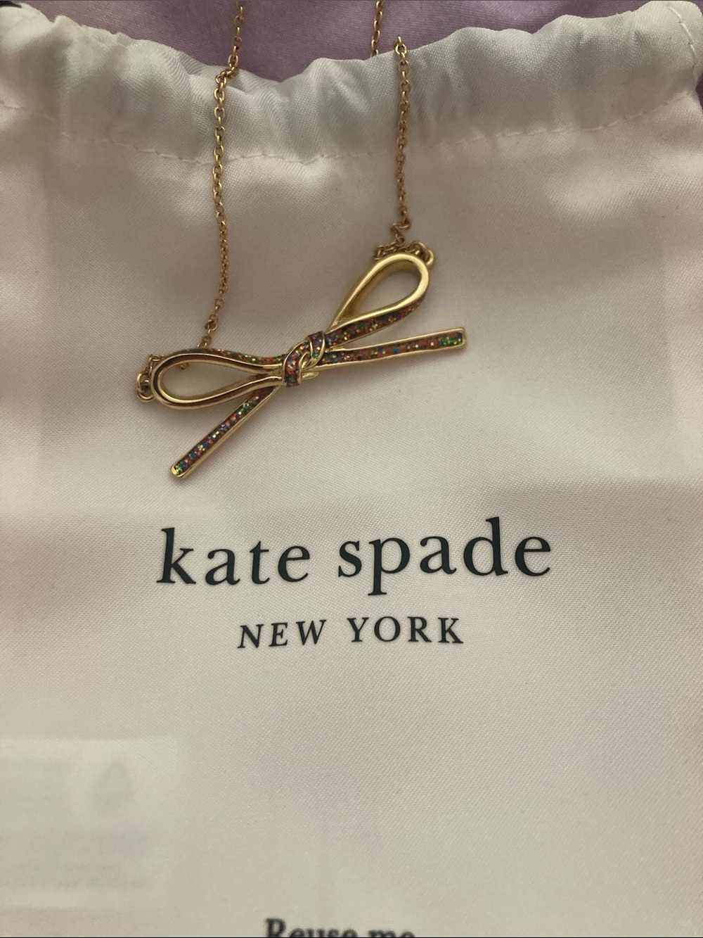 kate spade gold bow necklace with iridescent stones